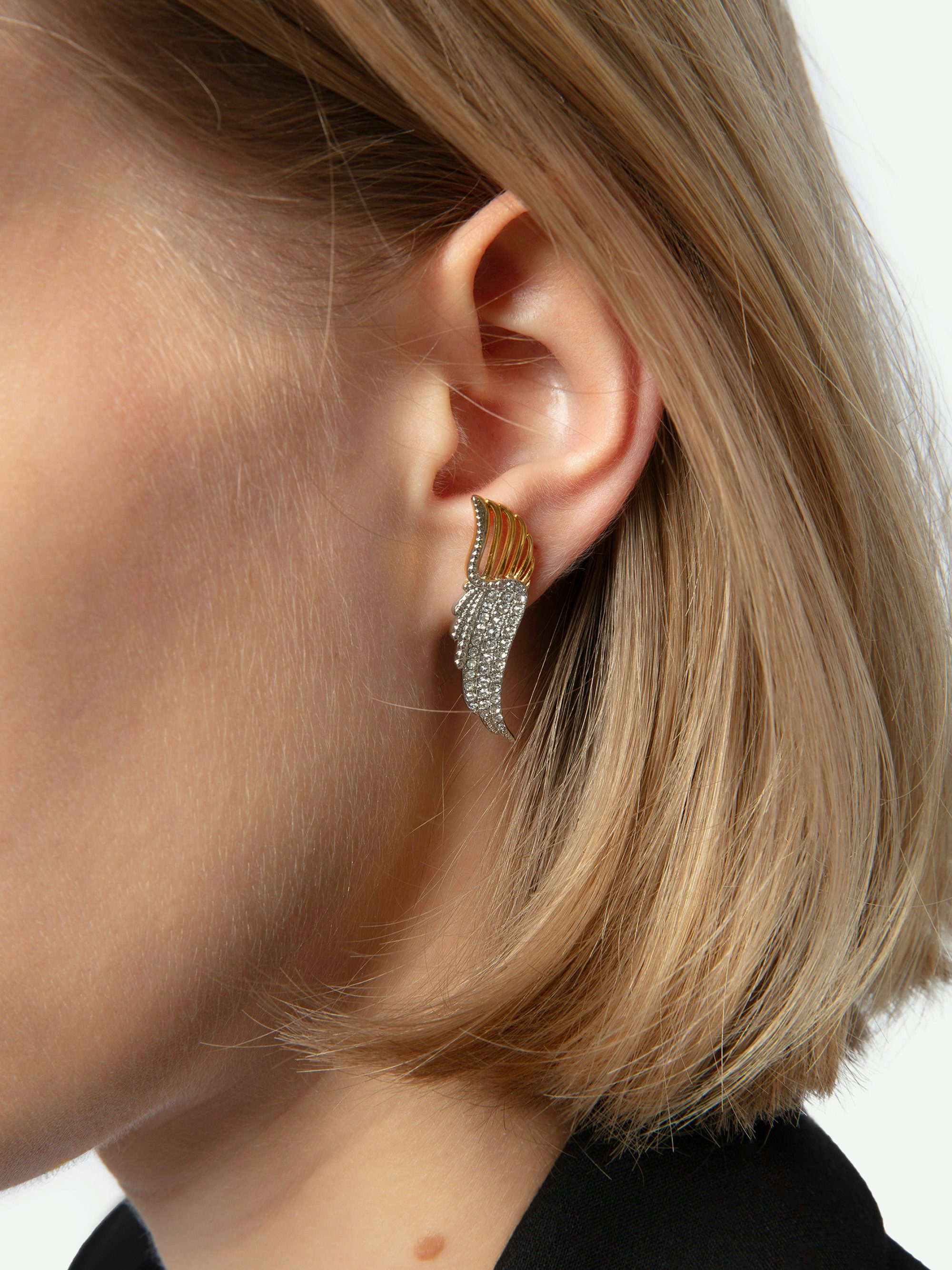 Rock Over Earrings - Wing-shaped earrings in gold-toned metal set with rhinestones.